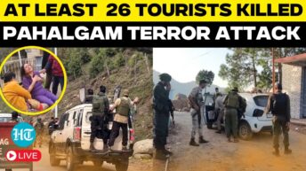 “A quiet stretch of road in Pahalgam with police presence and floral tributes placed by locals in memory of the recent tourist attack victims.”