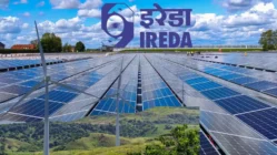 A red downward graph showing IREDA share price fall with renewable energy icons in the background.